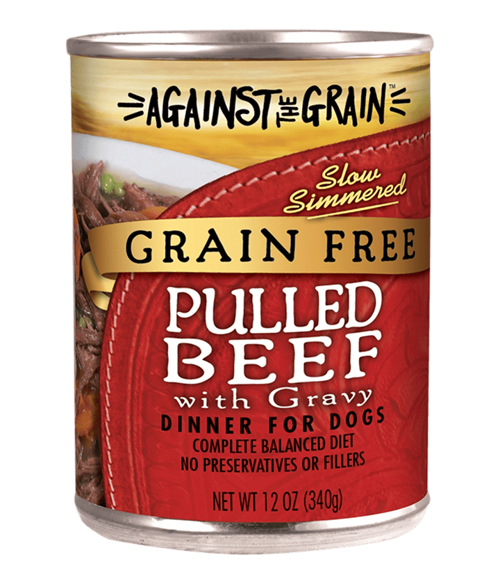 A 12 oz can of Aloha Tuna with Crab & Seaweed dog food, labeled as a complete balanced diet with no preservatives or fillers.