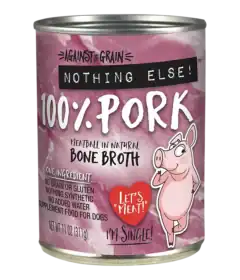 A can of Against the Grain Nothing Else 100% Pork meatball in natural bone broth dog food, featuring a cartoon pig and ingredient details on a pink label.