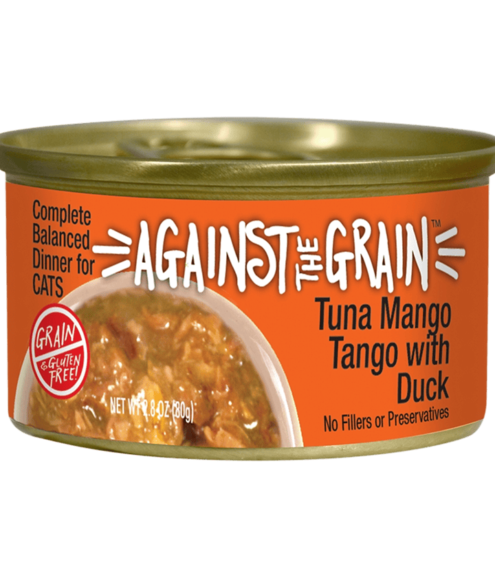 An orange can of Against the Grain cat food labeled "Tuna Mango Tango with Duck," showing the food inside through a clear section on the left.
