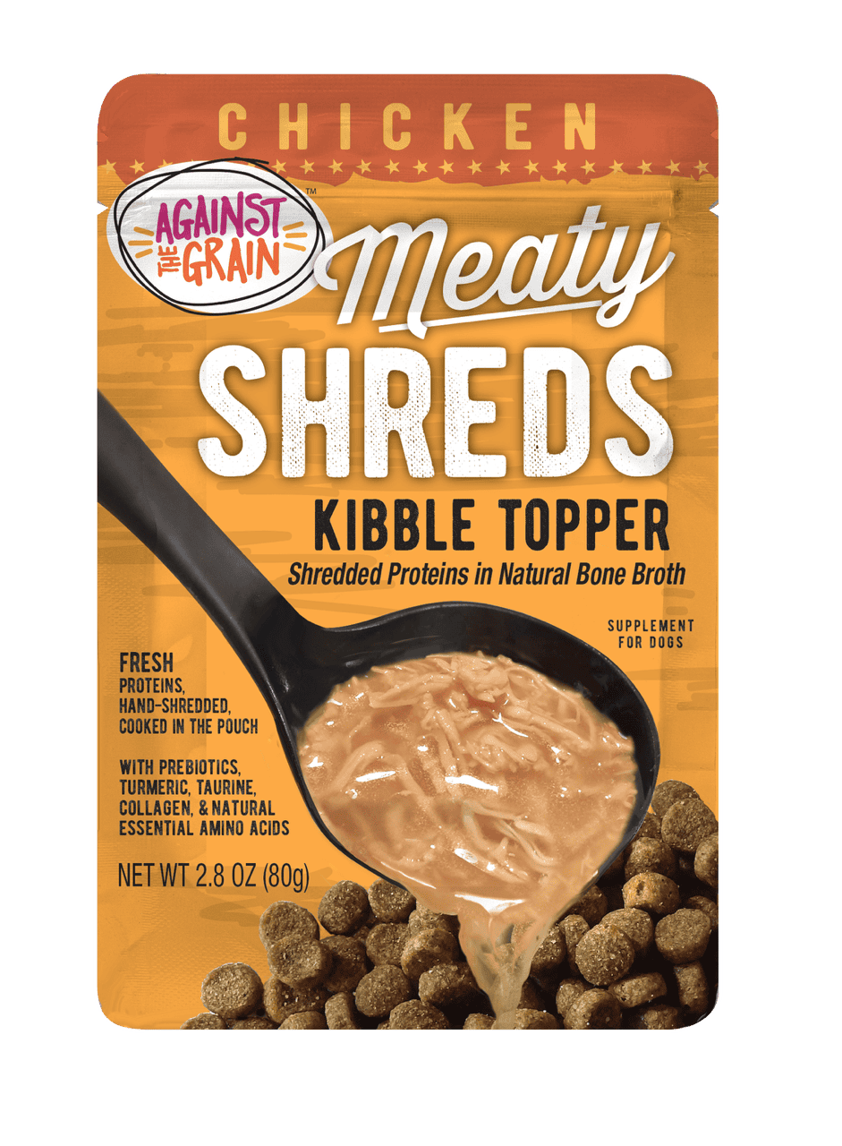 A pouch of Shreds Slow Cooked Shredded Chicken Kibble Topper for dogs, featuring shredded chicken in broth poured over dog kibble. Net weight 2.8 oz.